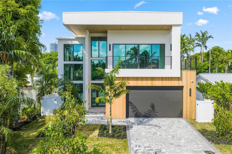 Elite does it again! This stunning 5-bedroom, 6-bath modern masterpiece features soaring ceilings throughout, a dramatic floating staircase, and a chef’s kitchen with a premium Thermador appliance package and hidden walk-in pantry. The spacious second-floor loft offers flexible living space, while the outdoor oasis boasts a built-in grill, spa, and pool—perfect for entertaining. Exceptional craftsmanship, sleek design, and luxurious finishes make this home truly one-of-a-kind.