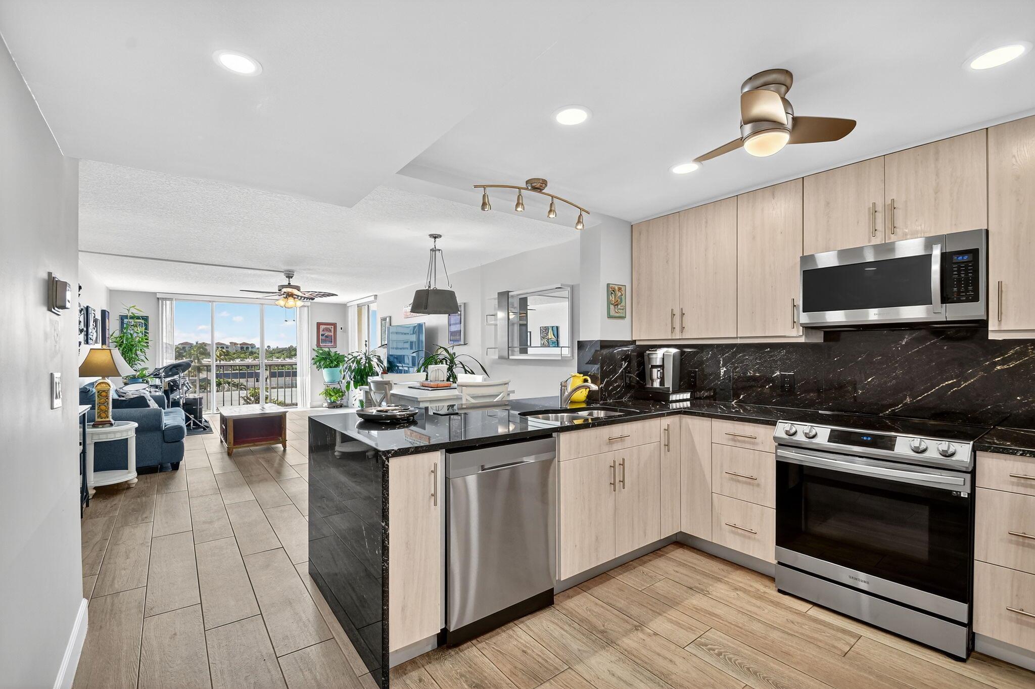 Updated 2/2 on barrier island! Tranquil Intracoastal and Sunset Views! Bonus: SEPARATELY DEEDED 98 SQ. FT. UTILITY ROOM with AC and Electric also available (less than 10 in the building).  Use it for toy storage, office or workshop in addition the units regular storage closet.  Renovated kitchen with granite counters, tile floors plus designer baths! Inviting living area with generous space for entertaining and relaxing with family and friends. The heart of the space is the corner balcony. The living room has both a south and west facing sliders for a corner view of the intracoastal and sunsets. It is deep and long, so the space is wonderful for all occasions. The property has a pool, sauna and community room on the ICW plus deeded beach access across the street.