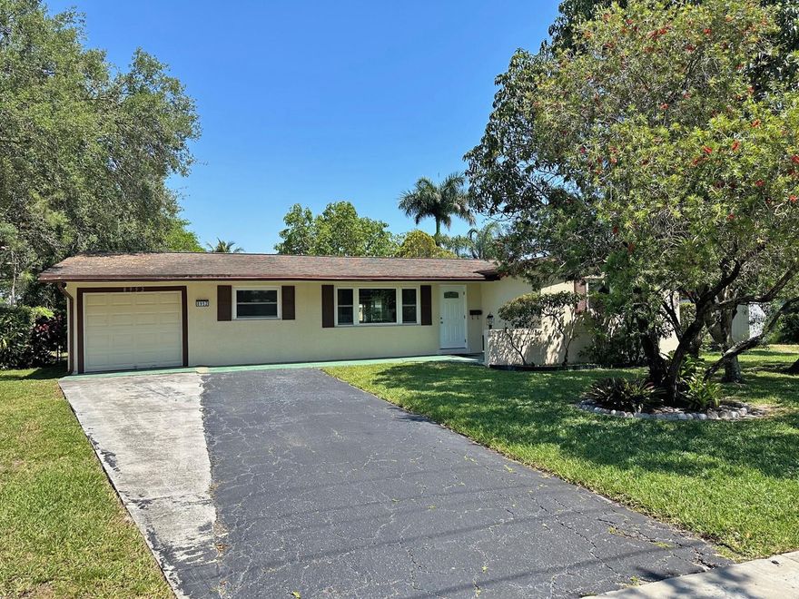 Newly Priced, lovely home in heart of Cooper City. Waterfront, 3-bedroom, 2-bathroom, plus office, 1-car garage with oversized fenced corner lot. Roof replaced in 2006, Impact Windows in 2009, AC replaced 2020, Water Heater replaced 2021, Front & Office Doors replaced 2023. Tile throughout living areas & wood flooring in master bedroom & second bedroom. Exterior includes a small dock over the canal, storage shed, and fruit trees including mango, avocado, and starfruit.  Situated in a family friendly neighborhood, home is zoned for A-rated schools, and the surrounding area offers a variety of amenities, including shopping centers, dining options, and entertainment venues, all within a short drive.  No HOA and no association to pay or deal with. Home is ready for new owner to make it theirs.