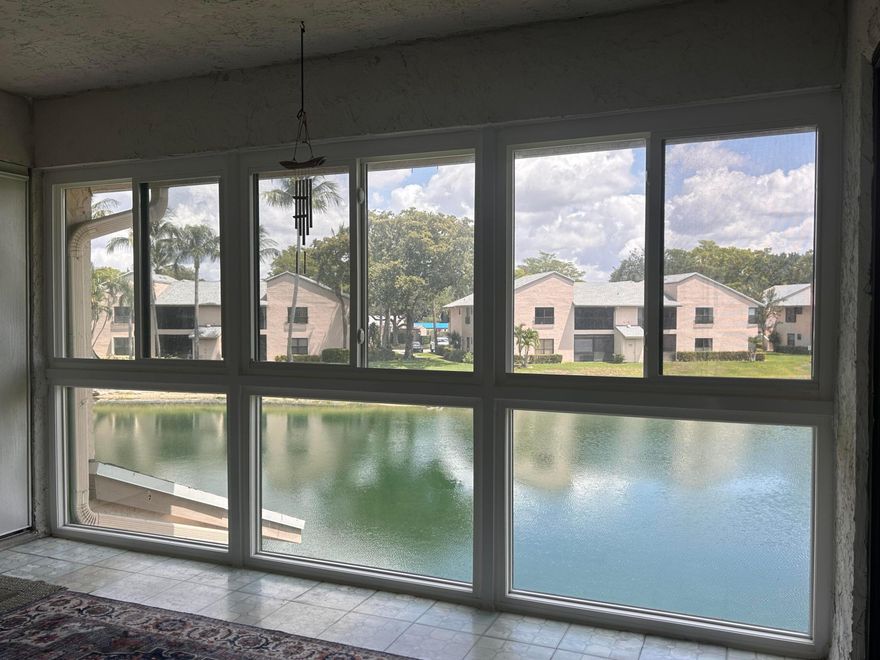 GREAT COMMUNITY OF ''KARANDA VILLAGE V'' IN THE DESIRED ''TOWNSHIP'' DEVELOPMENT OF COCONUT CREEK. A 3/2 SON THE 2ND FLOOR W/ STUNNING WATER VIEWS OF THE LAKE. CONDO HAS HAD MANY UPGRADES INCLUDING:  ROOF (2023), WATER HEATER (2024), WALK-IN SHOWER TILED TO CEILING, W/ COMMERCIAL GRADE GLASS & SWINGING DOOR & BARS FOR SAFETY (2023). BOTH BATHS REMODELED W/ CHERRY CABINETS & GRANITE COUNTERS. AC WAS MOVED FROM CEILING TO ENTRY CLOSET MAKING IT MUCH QUIETER & EASIER TO REPLACE FILTERS. ENCLOSED LANAI/FLORIDA ROOM HAS COMPLETE HURRICANE IMPACT WINDOWS EXPANDING THE LIVING AREA & LAKE VIEWS. THE LAUNDRY CLOSET HERE HAD WASHER & DRYER REPLACED. KITCHEN REMODEL INCLUDES RECESSED CEILING LIGHTS, POPCORN REMOVED & MATCHING WHITE APPLIANCES ADDED. SPLIT BEDROOM/BATH PLAN IS GREAT FOR GUESTS. (to pg CONDO HAS COMMUNITY POOL WITHIN WALKING DISTANCE. ALSO, SOME OF THE RESORT STYLE AMENETIES INCLUDED W/ THE "TOWNSHIP" MASTER ASSOCIATION HOA DUES ARE: FITNESS CENTER, OLYMPIC POOL, THEATER, SPORTS COURTS FOR PICKLEBALL & TENNIS, GAME ROOMS FOR POOL, PING PONG, CARDS & MUCH MORE. COCONUT CREEK IS A WONDERFUL SOUTHEAST FLORIDA TOWN TO LIVE IN. SHOPPING, ENTERTAINMENT, CASINOS, SPORTS ARENAS, ENDLESS RESTAURANTS, DOCTORS, AIRPORTS, MAJOR HIGHWAYS ARE ALL JUST MINUTES AWAY. SNOWBIRDS & INVESTORS WELCOMED, TOO! CALL FOR YOUR APPOINTMENT TO SEE THIS CONDO NOW!