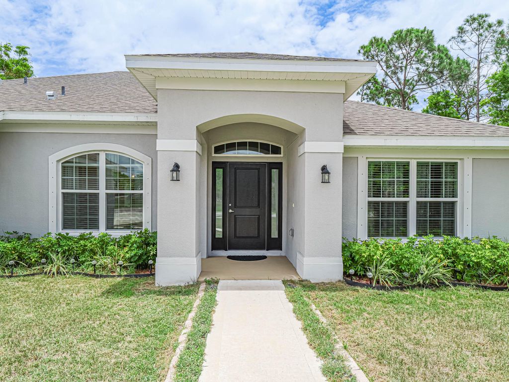 Photo of 2211 SE Berkshire Boulevard, Port Saint Lucie, FL 34952 (MLS # R10995673)