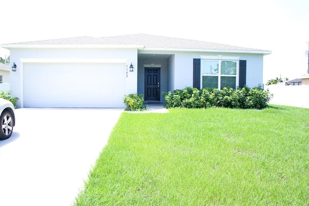Photo of 1382 SW Halford Avenue, Port Saint Lucie, FL 34953 (MLS # R10827566)
