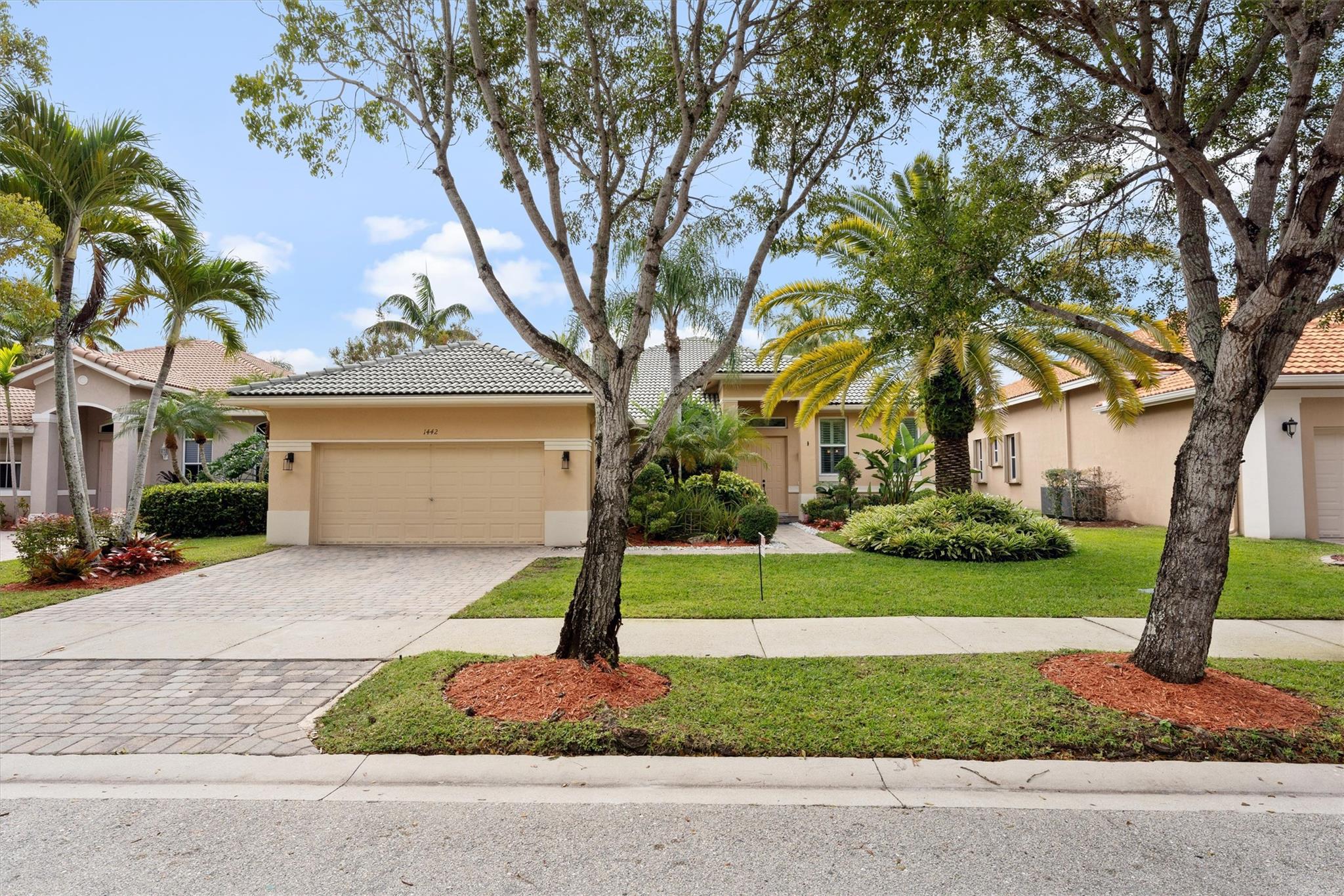 Absolutely stunning updated property that shows like a model. This large 4 bedroom 2.5 bath home sits on an oversized lakefront lot with over 11,625 SF of land offering lots of privacy. Newly installed porcelain tile plus new real wood floors in all bedrooms. Interior features Custom decorator touches through out with high volume ceilings and crown molding. Updated Bathrooms along with open Kitchen with large island, upgraded 42 inch cabinets and counters with stainless appliances. Exterior features spectacular heated pool and large patio area with gorgeous lake views. Huge custom covered area from builder, new impact windows and more! Community offers Guard gated, A+ schools, great recreation area, pools and amenities!