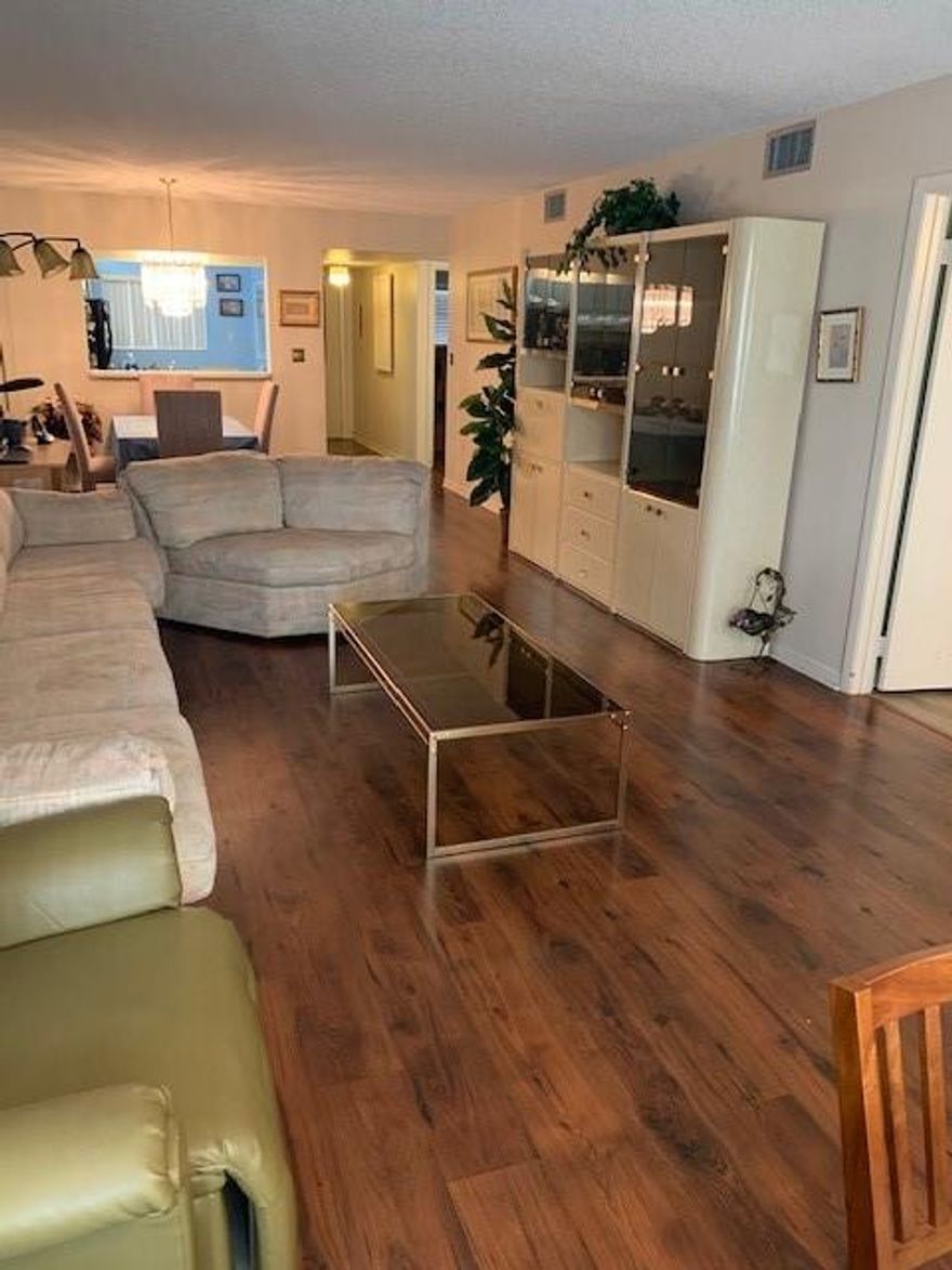 Beautiful location near all major highways, restaurants, shops, and more! Large 2 bedrooms 2 full bathrooms. This unit features a split floor plan, wood floors throughout, large eat-in-kitchen, florida room, hurricane shutters, laundry room inside the unit, and plenty of storage.  Building has an elevator.  Community features a beautiful pool, billiard room, fitness center, community room. Fall in love with the views from this unit! Beautiful location near all major highways, restaurants, shops, and more! Large 2 bedrooms 2 full bathrooms. This unit features a split floor plan, wood floors throughout, large eat-in-kitchen, florida room, hurricane shutters, laundry room inside the unit, and plenty of storage.  Building has an elevator.  Community features a beautiful pool, billiard room, fitness center, community room. Fall in love with the views from this unit!