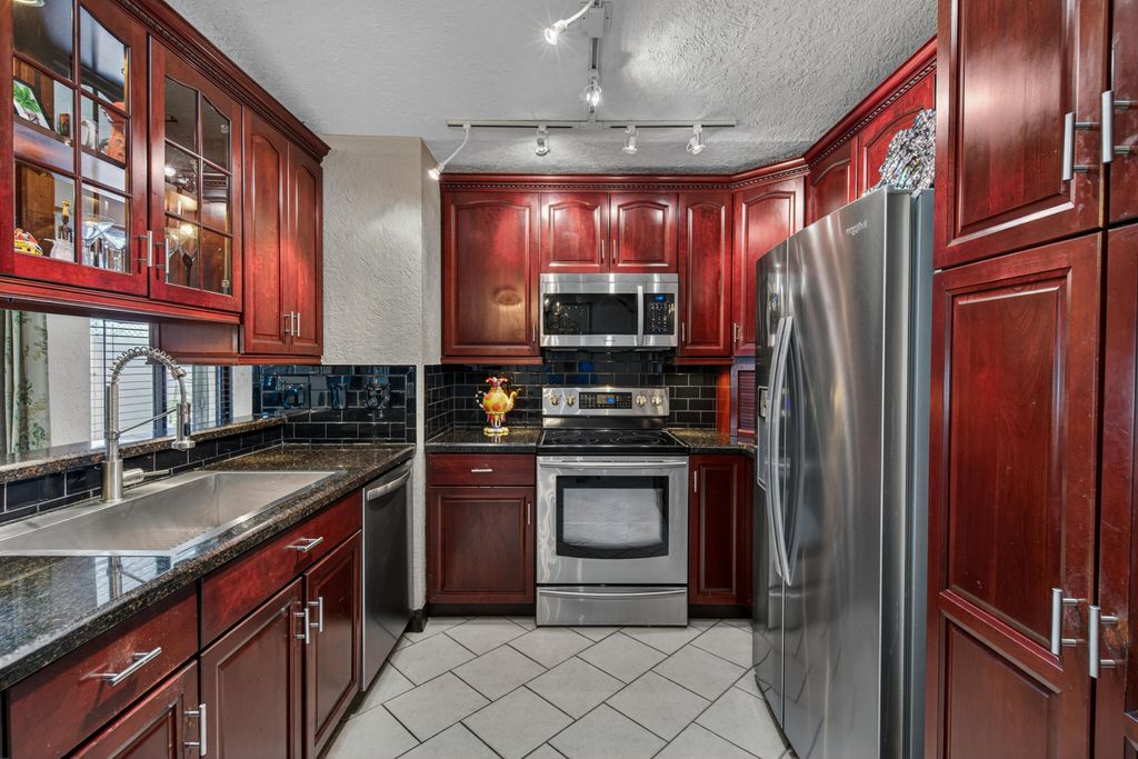 Photo of 3068 S Oakland Forest Drive #806, Oakland Park, FL 33309 (MLS # B26027305)