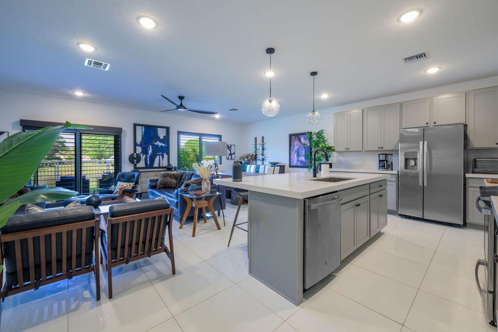 **Property comes with a 2-1 rate buydown**This nearly new townhome is ready for you to make it your own. Featuring high-end appliances, a stunning quartz stone accent wall, stylish fans/fixtures & numerous upgrades throughout. This home exudes modern elegance. The impressive kitchen boasts contemporary cabinets, abundant storage & a generous walk-in pantry, seamlessly flowing into a spacious great room that's perfect for entertaining. Enjoy your morning coffee or evening meals on the back patio, which offers serene pond views visible from both the great room & owner's suite. The upper level open loft provides a versatile space for a home office or kid's play area, while a convenient second-floor laundry room makes laundry days a breeze. Come see this property & the beautiful community!