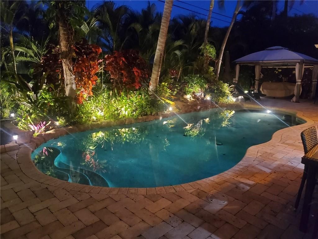 Photo of 451 NE 25th Ter, Boca Raton, FL 33431 (MLS # F10286134)