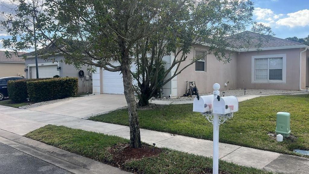 Photo of 252 SW Manatee Springs Way, Port Saint Lucie, FL 34986 (MLS # B26000839)