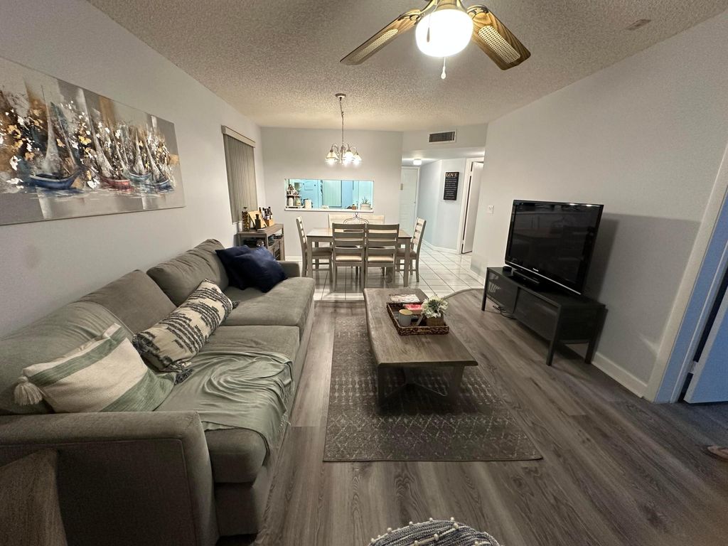 Photo of 3138 Via Poinciana #317, Lake Worth, FL 33467 (MLS # B26032106)