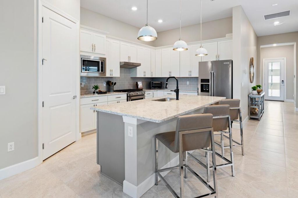 Photo of 579 SE Villandry Way, Port Saint Lucie, FL 34984 (MLS # R11139224)