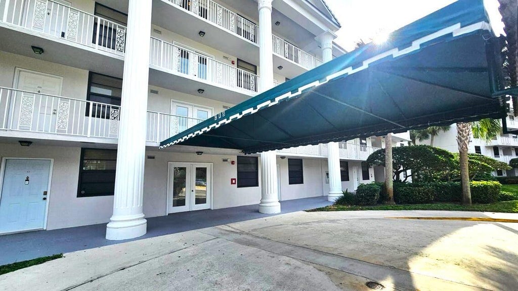 Photo of 3630 WHITEHALL Drive #303, West Palm Beach, FL 33401 (MLS # B26087680)