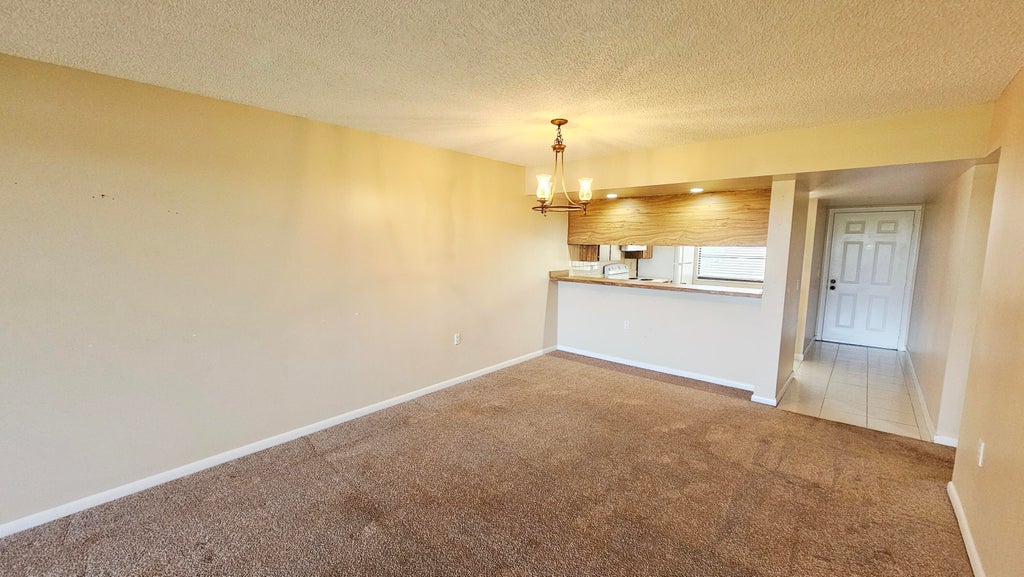 Photo of 3630 WHITEHALL Drive #303, West Palm Beach, FL 33401 (MLS # B26087680)