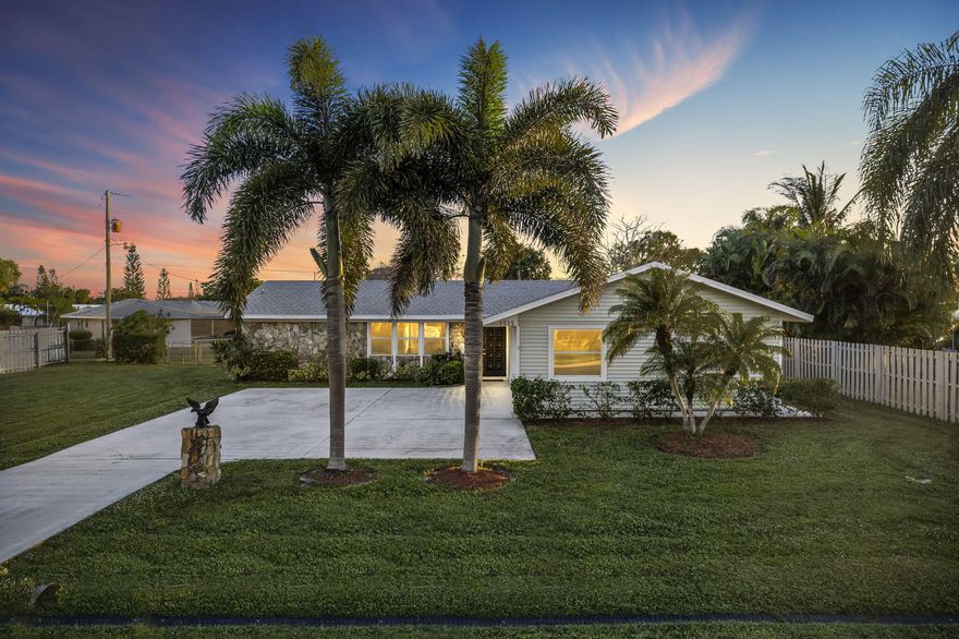 This newly renovated home has it all and ready to move in now.  Split bedroom layout, with large open living room.  Master bedroom has double vanities and walk in closet.  Large screened in lanai with fenced yard.  All new Vinyl flooring throughout. Inside laundry room and 2 car garage with large front yard and driveway.  Close to shopping and restaurants. New Roof 2023.