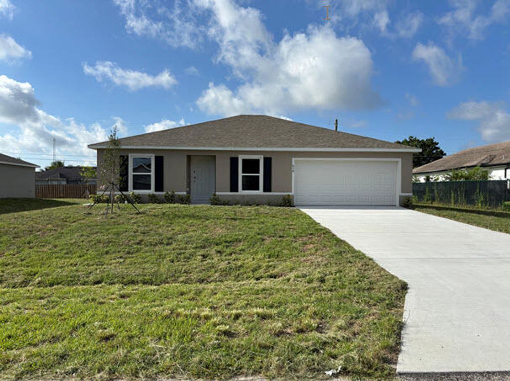 Photo of 934 SW Mcdevitt Avenue, Port Saint Lucie, FL 34953 (MLS # R11093390)