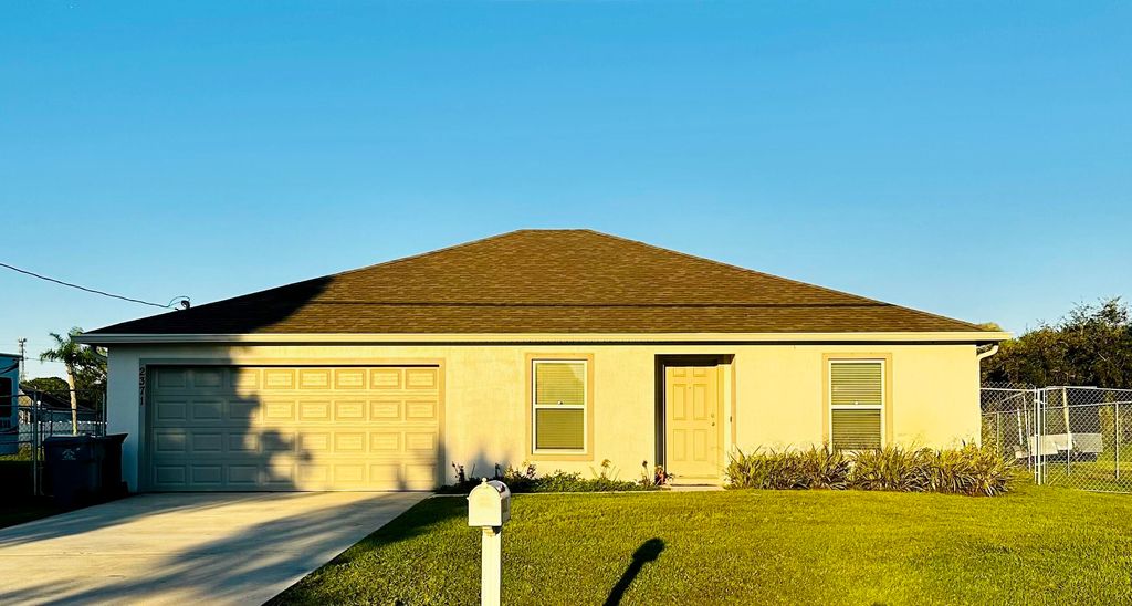 Photo of 2371 SW Chestnut Lane, Port Saint Lucie, FL 34953 (MLS # R10938539)