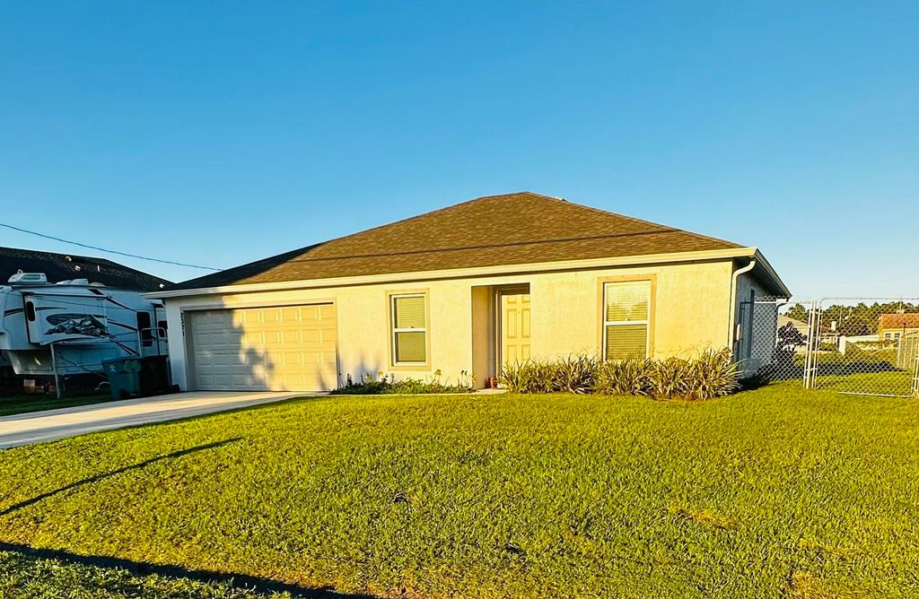 Photo of 2371 SW Chestnut Lane, Port Saint Lucie, FL 34953 (MLS # R10938539)