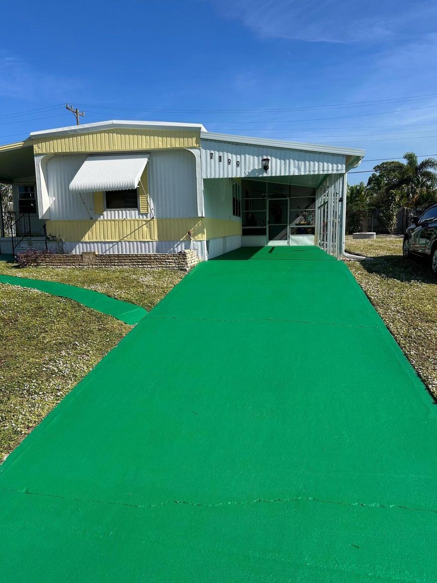 A charming 2-bedroom, 2-bathroom mobile home with a large sunroom, along with a large screened-in porch. This home is in a quiet community and offers a relaxing lifestyle. Come check out this little gem and start living the Florida dream.