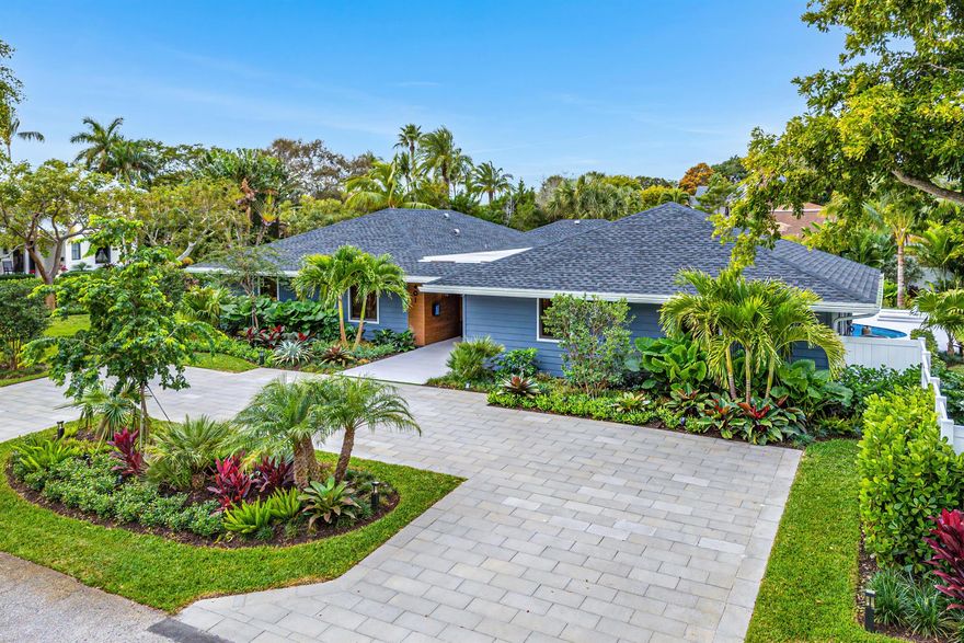 Nestled on a sprawling corner lot, this rare Delray Beach gem offers the perfect combination of Hamptons elegance, midcentury charm and contemporary luxury. The residence is set on a lush, oversized lot, framed by custom landscaping that offers both privacy and beauty. Thoughtful renovations completed between 2021-2024 have transformed every corner of the house, from the flooring and walls to the exterior and roof, creating a modern sanctuary that seamlessly integrates with its lush surroundings. With 2,493 square feet under air and 4 bedrooms, the new open concept kitchen and family room leads to a spacious covered lanai that perfectly captures the essence of Florida's outdoor lifestyle. The backyard is an entertainer's dream, complete with al fresco dining, a luxurious..