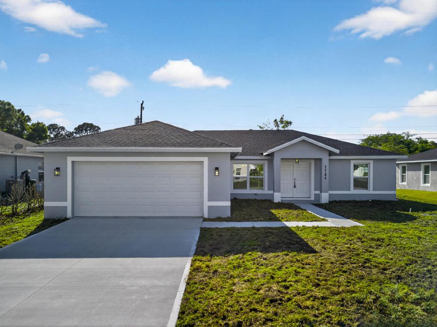 Just completed March 2026. If you've been thinking about trading the congestion for something better, Vero Beach delivers. Brand new 3/2/2 with impact windows, double front doors, no HOA, and 1,839 sq ft of real living space in one of the fastest growing pockets of Indian River County. Wood plank tile throughout, high ceilings, and oversized windows that remind you every single day what Florida living is actually supposed to feel like. The kitchen has quartz countertops, stainless appliances, and opens into a large living and dining space with enough room to set it up however fits your life. The primary suite has 2 walk in closets, double vanities, generous counter space, and a large shower with a rain head that makes mornings worth waking up for.  EZ to show