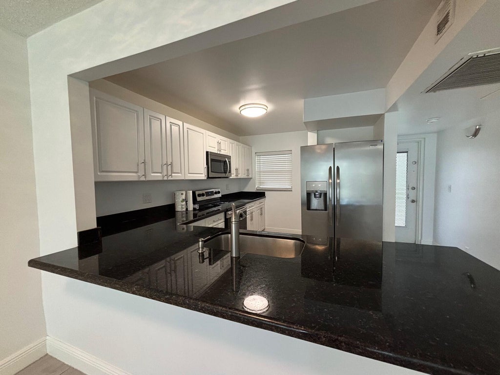 Photo of 9325 Lagoon Place, Davie, FL 33324 (MLS # B26069613)