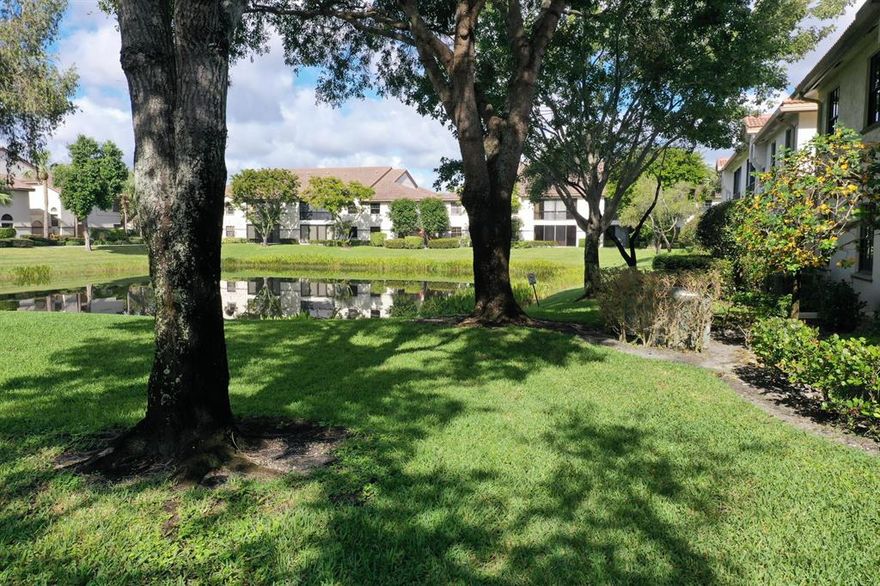 This FIRST FLOOR condo in Platina's LUCENTE VILLAGE with a BRAND NEW AC (INSIDE and OUT) and CORNER LAKE VIEW is waiting for you to update it and make it your own. LOCATION MATTERS and this GRANDI MODEL unit has SO MUCH POTENTIAL! Enter through the SCREENED, COVERED ENTRY with its PRIVATE BONUS STORAGE ROOM and you will be greeted by CERAMIC TILE FLOORING that spans all the areas except the TWO LARGE BEDROOMS. The MASTER BEDROOM has DUAL CLOSETS (most Grandi models have only one!) and a LINEN CLOSET. MASTER BATHROOM with DUAL SINKS, VANITY, ROMAN TUB and WALK-IN SHOWER. The DEN with DOUBLE DOORS is EASILY CONVERTIBLE to a THIRD BEDROOM. The SPLIT FLOOR PLAN offers privacy for you and your guests. GLASS and SCREEN ENCLOED PATIO. DON'T DELAY! This home is PRICED TO SELL. Platina is a community that offers care-free, resort-style living at its best! AT&T FIBER OPTIC HIGH SPEED INTERNET is INCLUDED IN THE CONDO FEES along with PEST CONTROL, ROOF MAINTENANCE and WATER. The active 20,000 square foot clubhouse is stunning! Cafe open for breakfast and lunch now offering take-out meals, card rooms, fitness center with stationary bicycles in a solarium overlooking the pool area. Relax in one of the satellite pools or at the enormous free-form main pool and spacious sundeck. Tennis, handball and pickleball courts. There is also an art room with a kiln! With shows, bingo, and an array of clubs, you will not be bored! 24-hour guard gated community. Convenient access to I-95 and the Florida Turnpike. Close to shopping and wonderful restaurants. Discerning buyers put PLATINA at the TOP OF THEIR LIST.