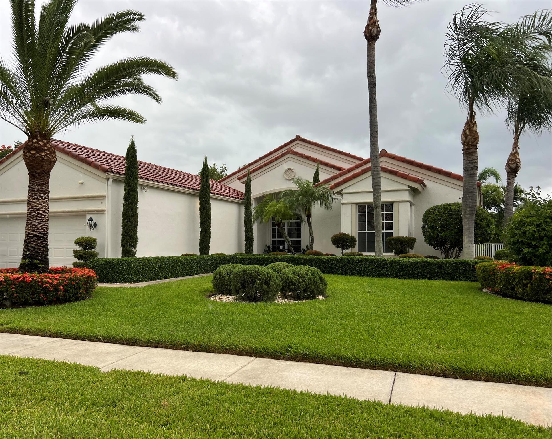 Welcome to 9627 Bergamo Street, a beautifully renovated single-family home nestled on a desirable corner lot in Lake Worth on the Wellington line. This bright and sunny 3-bedroom, 2.5-bathroom residence features a spacious den/office.Soaring 12-foot ceilings create a sense of openness throughout the home, complemented by abundant natural light that fills every room. The thoughtfully updated interior boasts modern finishes, an open-concept layout, and tasteful design choices ideal for everyday living and entertaining.Step outside to your private backyard retreat, complete with a sparkling pool and spa--perfect for relaxing or hosting friends and family year-round. The two-car garage provides ample storage and convenience.
