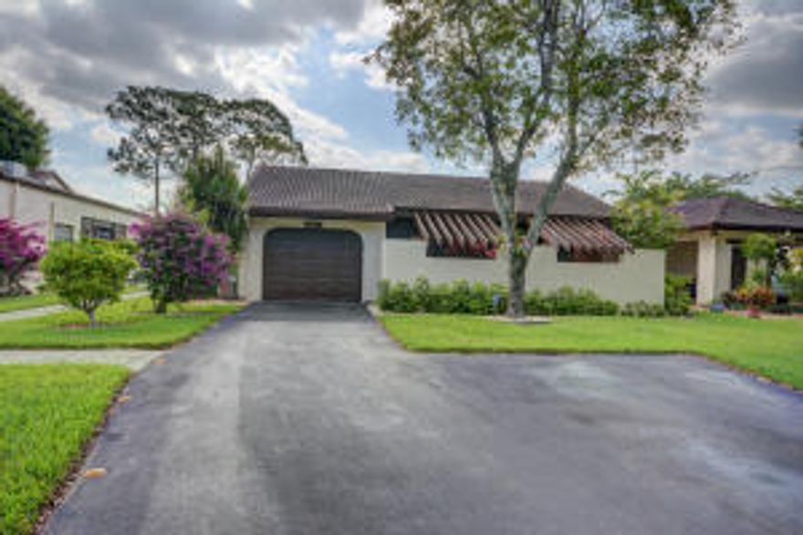 Stunning and spacious 3 Bedroom, 2 Bath corner villa overlooking lake and golf course. Vaulted ceilings, sky lights, large bedrooms, wet bar, plenty of closet and storage area, accordion hurricane shutters.  Boca Lago is a fantastic country Club community where membership is not mandatory.