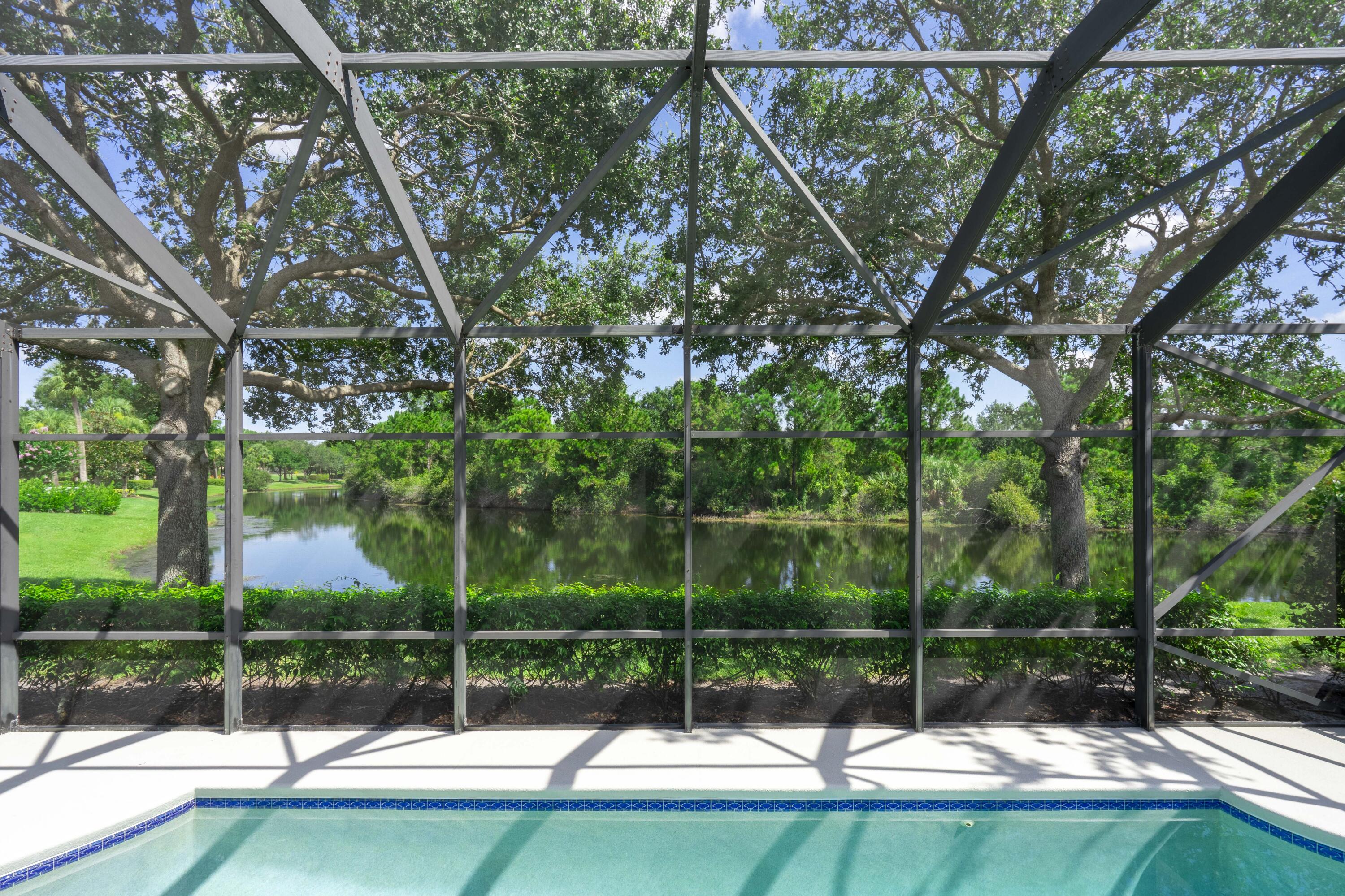 Some of the best lake views in PGA Village. No neighbors in the background. Landscaped for privacy. Salt water pool. 3 FULL baths. Very well maintained. COUNTY ONLY TAXES in PGA Village.54 holes of championship golf at PGA Golf Club, designed by Tom Fazio and Pete Dye plus an additional 18 holes at the Legacy Club. HOA dues include basic cable, internet, lawn care, security, common area maintenance and access to the Island Club. Pickleball, tennis, resort style pool, exercise rooms, ballroom, billiards, group activities, and more. Third bedroom could be used as a den as there is no closet.