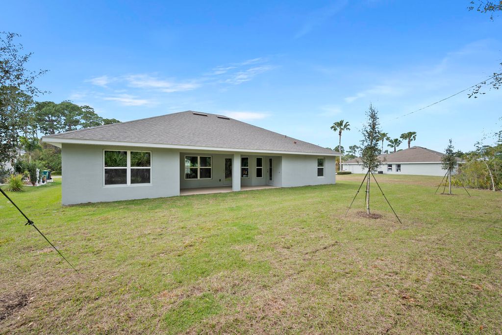 Photo of 372 SW Feldman Avenue, Port Saint Lucie, FL 34953 (MLS # R11111414)