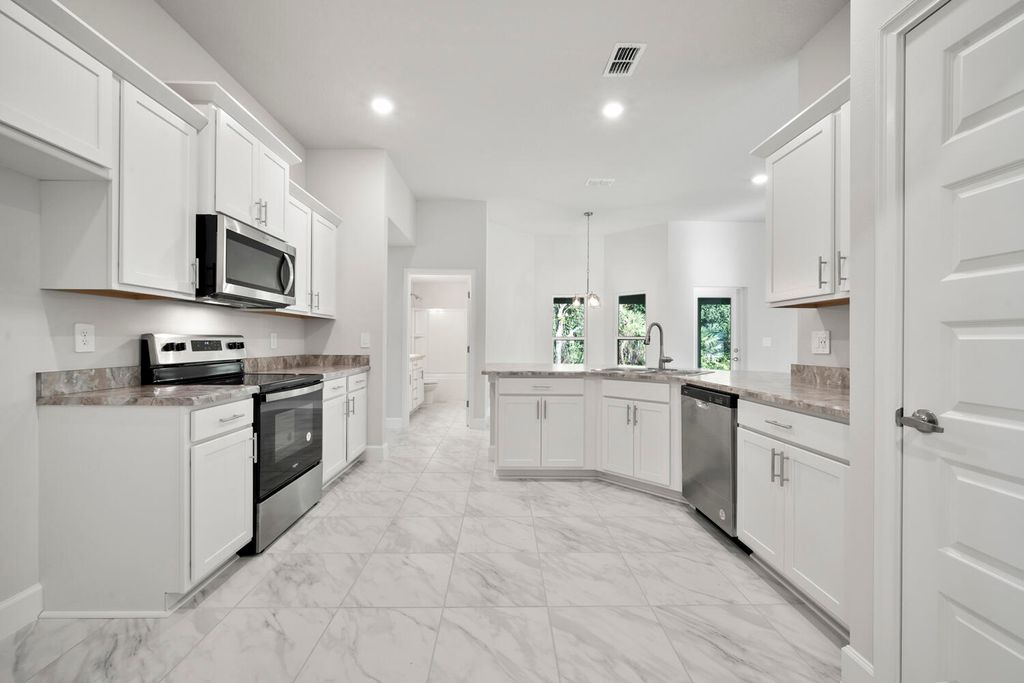 Photo of 372 SW Feldman Avenue, Port Saint Lucie, FL 34953 (MLS # R11111414)
