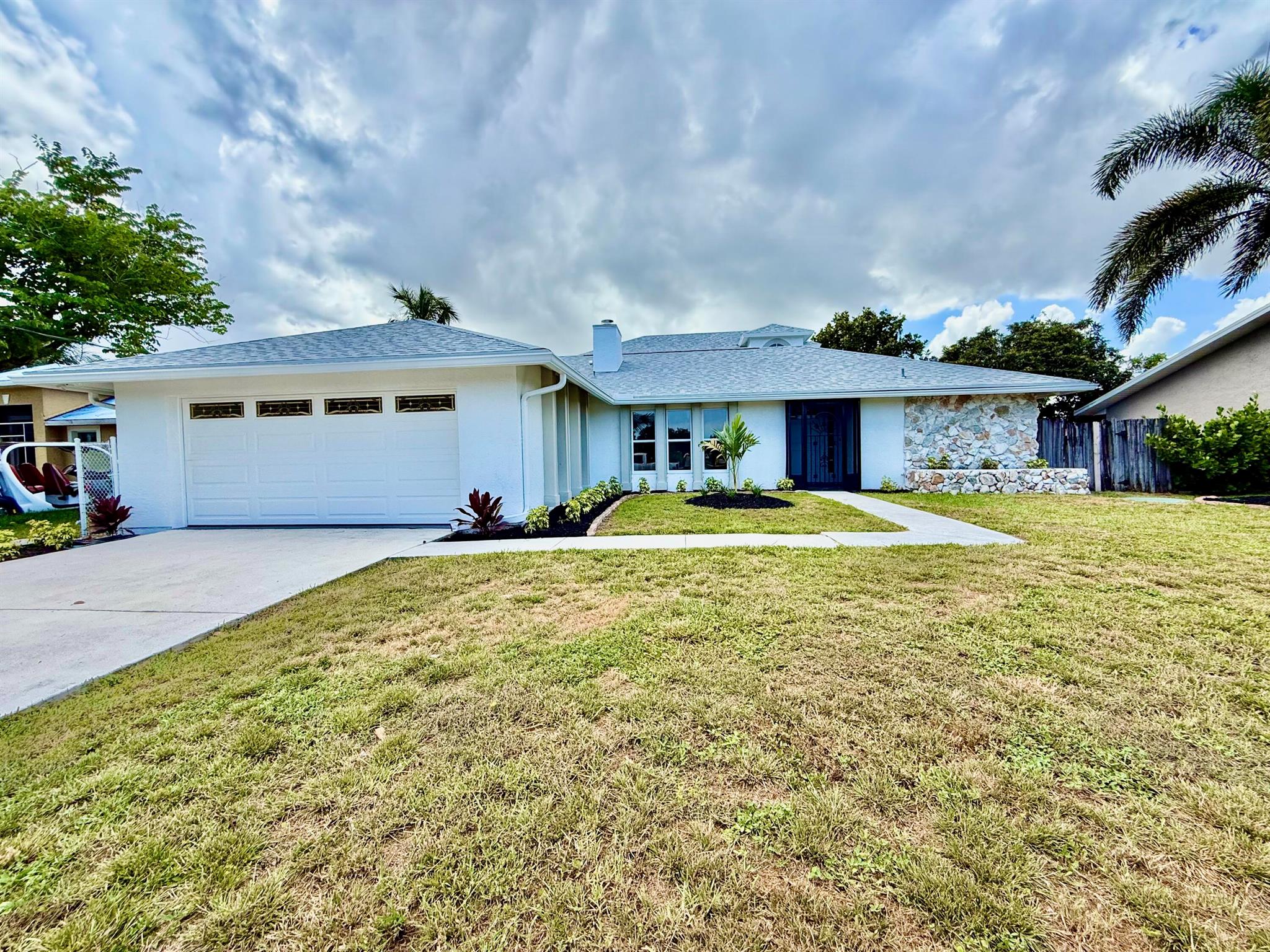 Fully Remodeled 4-Bedroom Home with Canal Views!This beautifully renovated 4-bedroom, 3-bathroom home in Port St. Lucie offers the perfect blend of modern upgrades and serene surroundings. Featuring a new roof, updated kitchens and bathrooms, this home is move-in ready and built to impress. Enjoy a bright and spacious layout ideal for both family living and entertaining. The modern kitchen boasts sleek cabinetry, premium countertops, and stainless steel appliances. Step outside to your private backyard with a Inviting Unground pool, peaceful views of the canal--a perfect setting for relaxing or enjoying Florida's natural beauty. With excellent curb appeal and situated in a desirable location near major highways, shopping, and schools, this home is a must-see!