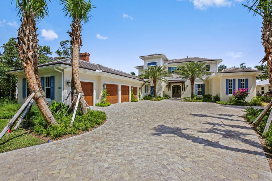 Newly built Coastal riverfront home on gated .92 acre estate. Quality construction, current engineered codes, all impact resistant windows & doors, high energy efficiency throughout and designer finishes. Volume coffered ceilings, hardwood floors, floor to ceiling linear vented fireplace, gourmet kitchen with 2 islands, 2 dishwashers and 48' gas range. First floor master suite, 2 walk in closets, luxurious marble bathrm, Kohler 6' tub and huge frameless shower. Spacious family area, office next to master, paneled elevator, 2nd floor clubroom, extensive covered balcony, Crestron Home Automation System and 20KW propane generator. Tremendous covered loggia with full summer kitchen, heated saline pool & spa, new dock & new 16K lb cradle style boat lift for 38' boat, minutes to Jupiter Inlet!