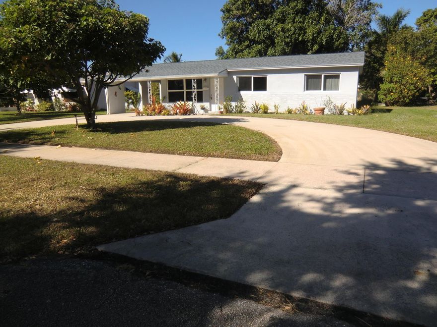 3-bedroom house on large 10,000 square feet lot.  Full protection with hurricane impact windows.  Indoor laundry room.  Big circular driveway plus carport.  Separate living room and family room.  Kitchen has ''Granite'' counters and solid Wood cabinets.  Room to park boat or RV.  Walk to shopping and dining and Kelsey Park  with tennis, marina, exercise trails, pickleball.  (No smoking, landlord must approve all pets).