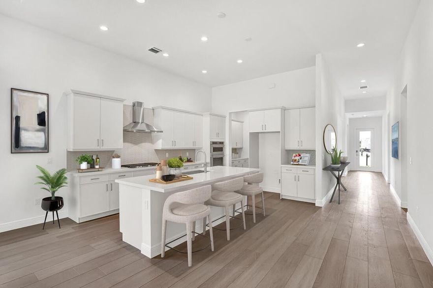 Live the luxury lifestyle in the prestigious gated community of Tesoro Club. This stunning Lior floor plan offers 3 bedrooms and 3 baths, is move-in ready, and filled with designer upgrades on an oversized cul-de-sac preserve lot. Enjoy soaring tray ceilings, impact-rated windows and doors, and an open, light-filled floor plan that blends elegance and comfort. The gourmet kitchen features a 5-burner gas cooktop, stainless steel appliances, and quartz countertops, while luxury vinyl plank flooring flows seamlessly through the main living areas and spacious primary suite. Step outside to a covered lanai and private backyard--perfect for relaxing or entertaining. The oversized garage provides ample space for a golf cart or additional storage. Virtual Staging is for illustrative purposes only.