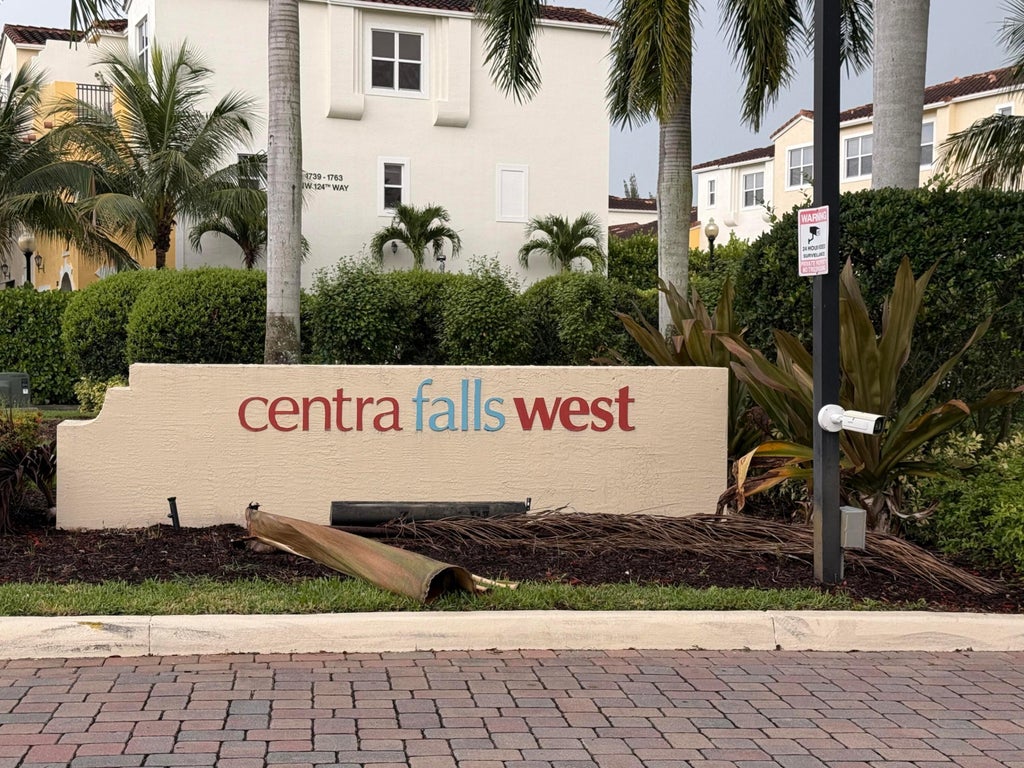 Photo of 1799 NW 124TH Way, Pembroke Pines, FL 33028 (MLS # B26091548)