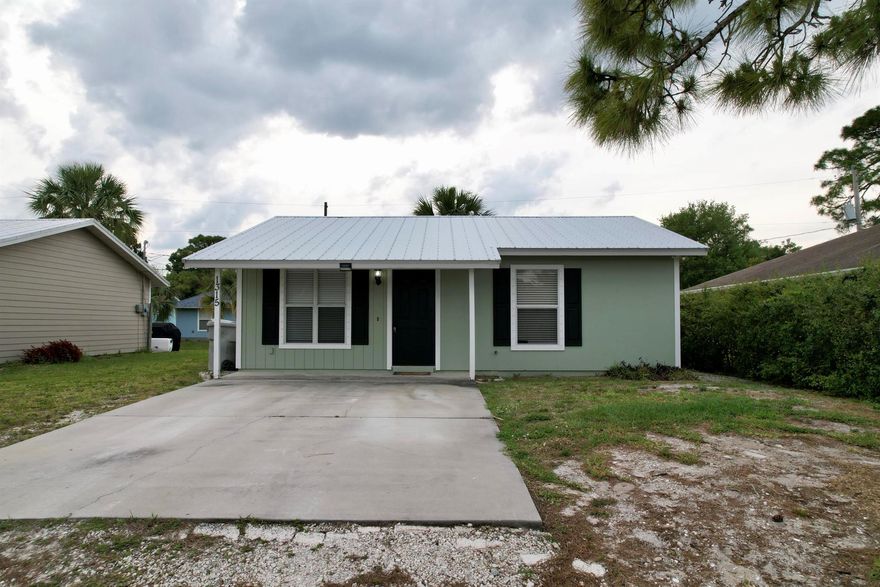 Welcome to this charming 2-bed, 1-bath home in the centrally located Oslo Park neighborhood. Featuring a 2019 metal roof, laminate flooring, and new siding, this residence offers durability and style. It also has metal hurricane panels to provide peace of mind during storm seasons. Enjoy cozy living spaces and two comfortable bedrooms. With its affordability and recent upgrades, this home presents an excellent opportunity for those looking for their first home or a bomb proof rental.
