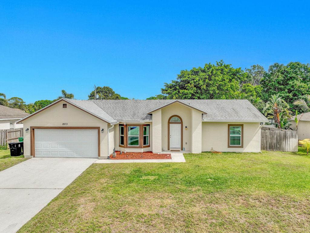 Photo of 1973 SW Davis Street, Port Saint Lucie, FL 34953 (MLS # R11068180)