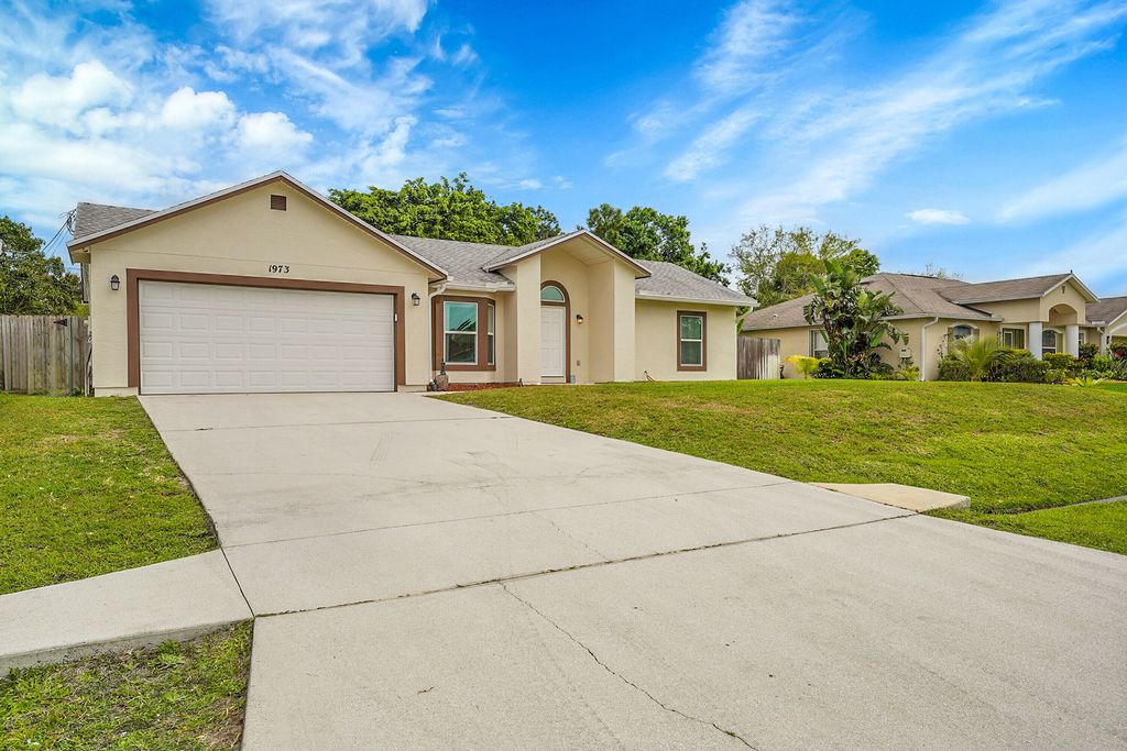Photo of 1973 SW Davis Street, Port Saint Lucie, FL 34953 (MLS # R11068180)