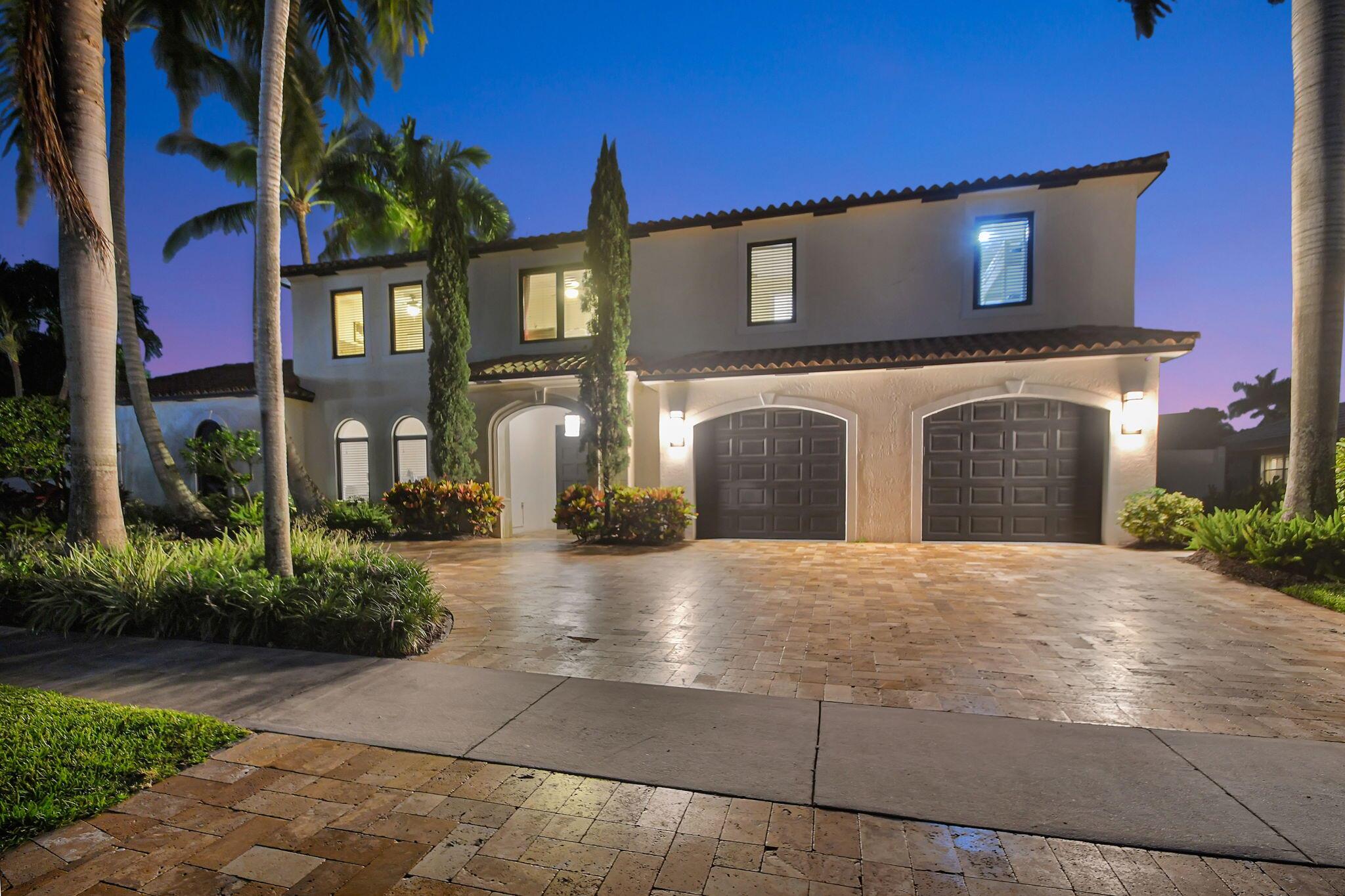 Welcome home to this magnificent, recently renovated, expansive estate located directly on Lake Eden on a private cul-de-sac. This stunning waterfront property sits on a 1/3-acre lot with a private dock and boasts six bedrooms and four and a half bathrooms, offering plenty of room for your family and guests to enjoy. Expansive double doors sweep open for your entry from the circular driveway where the sounds of a tranquil courtyard Koi Pond greet you. From here, you may explore the private entrances to the principal residence and the guesthouse, which features a bedroom, full bath, and media theatre. The serenity and functionality of this open floor plan are felt in every thoughtful detail. The kitchen boasts sparkling white countertops, top-of-the-line stainless Thermador