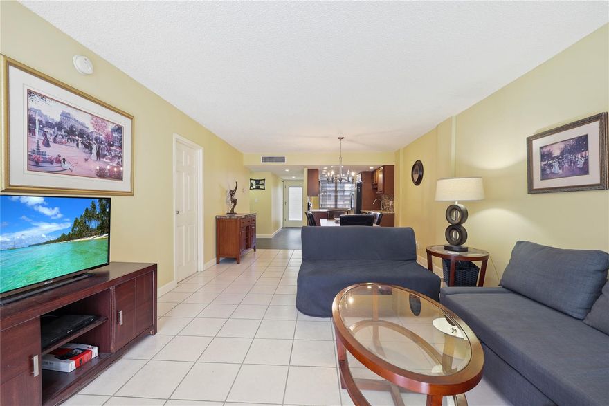 Spacious and bright 2-bed, 2-bath condo in a well kept 55+ Lauderdale Lakes community. Located on a quiet floor, this comfortable unit offers an open living and dining area, a large primary suite with walk-in closet, and a versatile guest bedroom ideal for visitors or a home office. The enclosed balcony adds extra space for relaxing. The kitchen is clean, functional, and filled with natural light. Community amenities include a heated pool, clubhouse, fitness room, shuffleboard, walking paths, and laundry on each floor. Conveniently close to shopping, dining, medical facilities, public transportation, and major roadways, this home delivers comfort and a low-maintenance lifestyle. Perfect for seasonal or full-time residents seeking value, convenience, and a welcoming community feel.