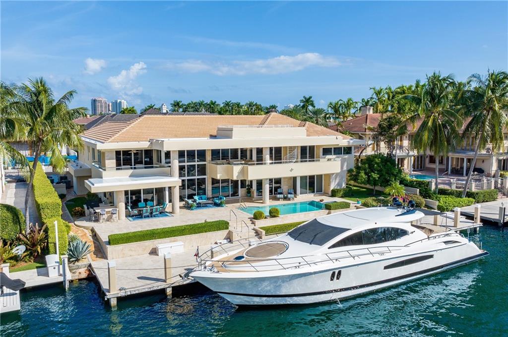 Spectacular Intracoastal views just one in from the Point in the Prestigious Harbor Beach gated community! Perfect for Yachters, this home has 120" WF with a large open turning Bay! Gated Contemporary custom home with fabulous open floorplan spread across two levels. Stunning living room is focal to great entertaining flow, w/wet bar, dining & media rooms, expansive gourmet kitchen, poolside breakfast room, elevator to family lounge/game area. Ultra luxurious Primary suite comprising entire wing w/private balcony. Add'l features include first floor VIP guest suite, 3rd floor sun deck with Intracoastal views, office, gym, separate guest apartment over the garage with kitchen, all impact glass & generator. Enjoy Harbor Beach private beach club and just minutes to the ocean by boat!