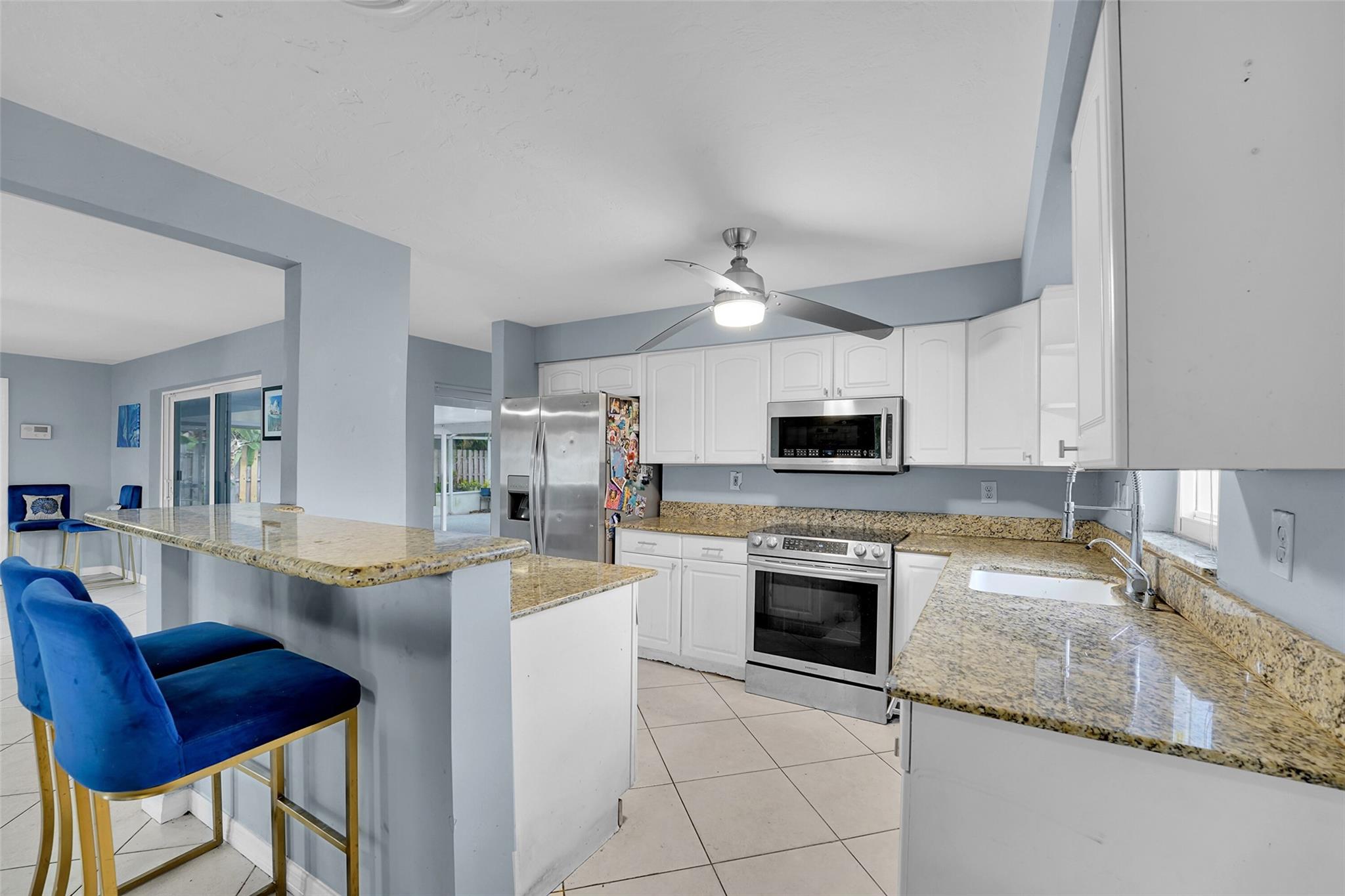 New A/C, Updated Electric and Natural Light Filled Open Floor Plan!!! Corner 3BR/2BA Pool Home in Desirable Lyons Park Community. Features include Impact Windows/Doors, and a Spacious 9,945 SF Lot. Enjoy a Large Custom Pool, Great Oversized Screened Porch/Patio, Circular Drive, and Carport Parking. Split Bedroom with Primary Suite Overlooking the Pool, Ceramic Tile Flooring, and Garden Views. Just minutes to Beaches, Boating, Dining, and A-RATED SCHOOLS. This Welcoming Neighborhood Offers a True Sense of Community and Easy Access to Everyday Conveniences—I-95, Publix, Parks, Playgrounds, Coffee Shops, and More. Ideal for Buyers Seeking Value, Location, and Potential in a Vibrant, Well-Located Neighborhood