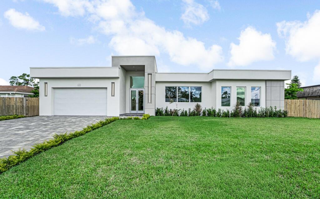 New-construction custom residence offers luxury living and gracious entertaining opportunities. five bedrooms, four and one half bathrooms with over 3289 living and over 4355 total square footage. A T-shaped kitchen island is a chef's dream, featuring a cooktop, wall oven, and ample storage. A decorative fireplace adds warmth to the living area. Step outside to a backyard with a pool and an open feel.  The residence also features complete hurricane impact windows and doors, a wet bar, a laundry room with custom shelving, and an oversized single-car garage. Best of all, there's no HOA to limit your freedom. This property is the perfect blend of luxury and privacy, waiting for you to make it your​​‌​​​​‌​‌​​​‌‌​​​‌‌‌​​‌​​‌‌​​​​ own.
