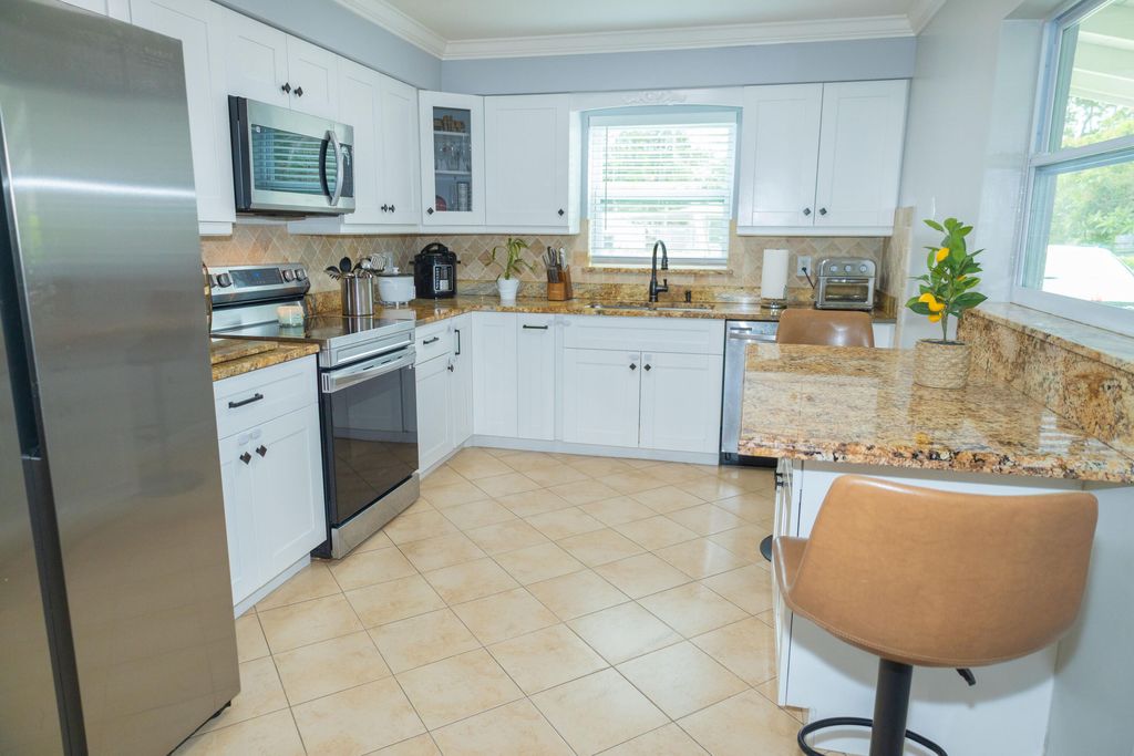 Photo of 411 Forest Estate Drive, West Palm Beach, FL 33415 (MLS # R11108184)