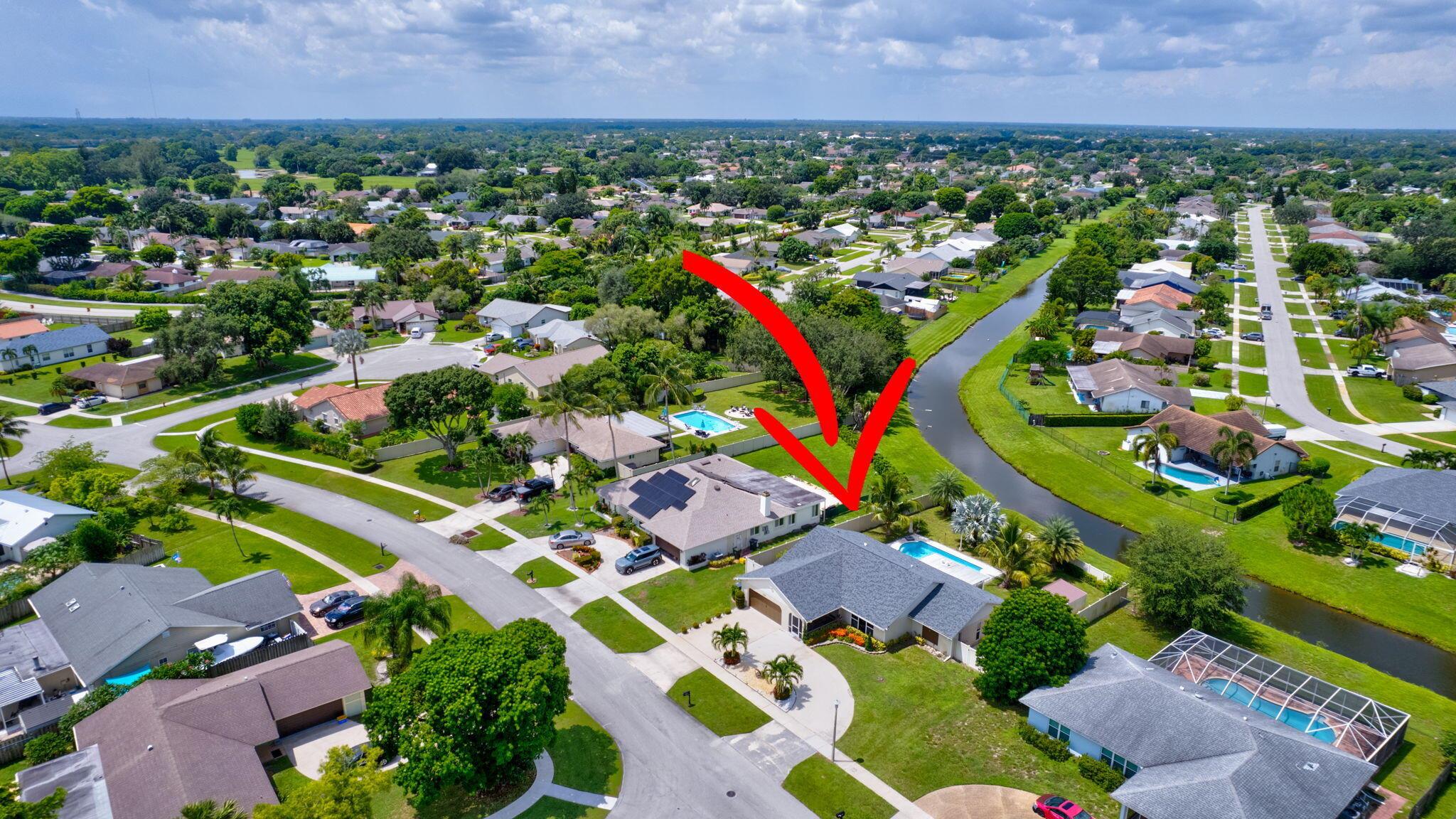THE PERFECT SEASON WELLINGTON RENTAL. No HOA. This furnished charming 3-bedroom, 2-baths CBS pool home on 0.27 acres is a dream come true for equestrians and pet owners alike. - Modern amenities: impact windows and doors, recently renovated kitchen & bathrooms, new washer and dryer. - Large fenced backyard along the canal ideal for humans, pets, and entertaining. Garage not included. - No HOA restrictions mean you can move in with ease and bring your pets or dually truck. - Prime Location: Just 4 miles from top equestrian venues such as the Winter Equestrian Festival, National Polo Center, and Global Dressage. You're also minutes away from shops, restaurants, highways, and only a 20-minute drive from the beach and Palm Beach International Airport. An opportunity you won't want to miss.