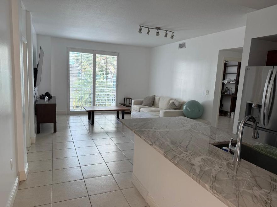 Beautifully updated and bright 2BR/2BA apartment in highly desirable Downtown Dadeland. This spacious residence features stunning new premium quartzite countertops and modern finishes throughout. Enjoy an elevated urban lifestyle with exceptional walkability- just steps from premier dining, boutiques, cafés, banks, and Dadeland Mall. Ideally located with easy access to major roads and transportation. Enjoy the convenience of the metro right next to the building. With a well-equipped, spacious gym right in the building with a rooftop semi-olympic pool and a sauna. A rare opportunity to own a stylish, move-in-ready apartment in one of Miami's most sought-after communities.