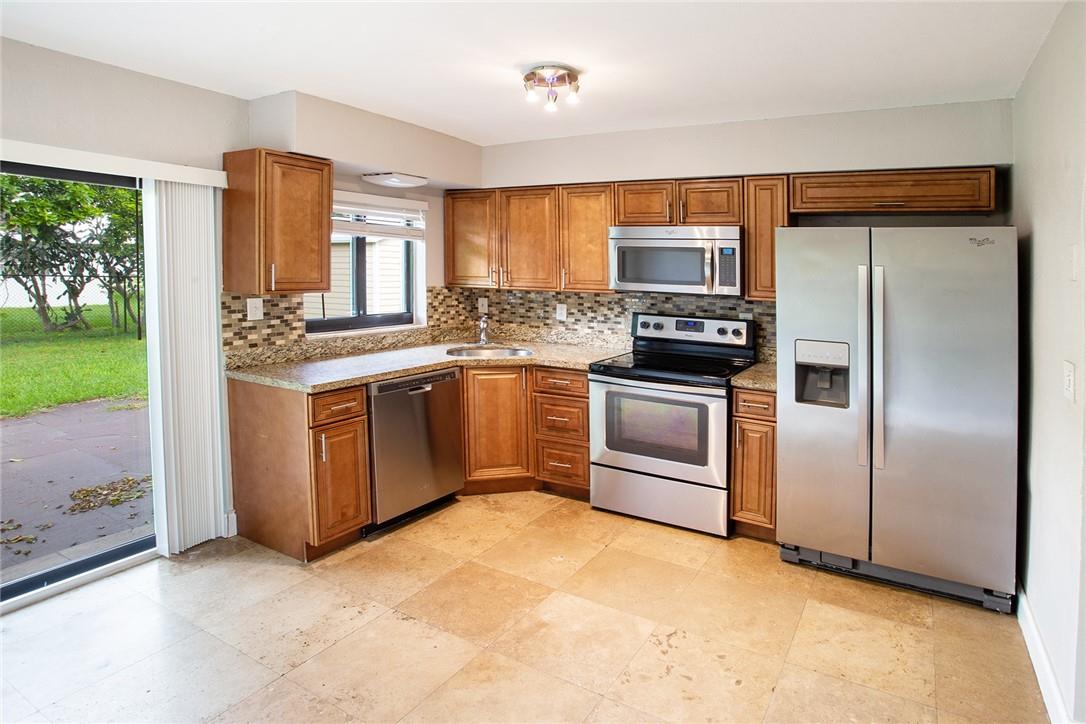 Beautiful 2BR/1BA single family home in a quiet Tamarac neighborhood! Enjoy a fenced yard with star fruit tree ,large shed and laundry room with new side by side refrigerator, washer and dryer. The home features fresh paint , newly renovated bathroom new widow shades hurricane windows and door and plenty of natural light. Very privet yet centrally located near I75 and turnpike shops restaurants plus enjoy access to community pool top rated schools don't miss the fantastic opportunity !