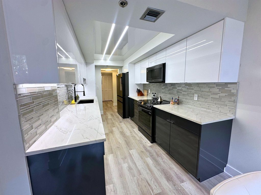 Photo of 20080 Boca West Drive #414, Boca Raton, FL 33434 (MLS # R11038621)