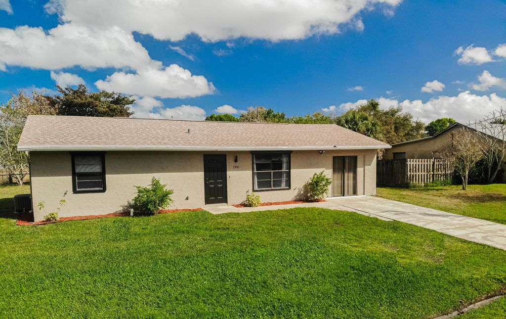 Photo of 1991 SW Agnes Street, Port Saint Lucie, FL 34953 (MLS # R10779412)