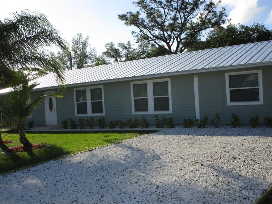 Extremely well maintained & updated 3/2 on a double wide fenced corner lot. Plenty of room to bring all your boats and toys! so many upgrades... hardi plank siding 4/2018, metal roof 3/2018, mostly impact & double pane windows 3/2018. Double pane  & sliders have panel protection. A/C 2/2016, tile & wood lam floors, water treatment system to entire home. Newer Kit cabinet, black range, DW & micro. Crown molding, knockdown ceilings, up dated guest & M/baths, interior laundry room, all newer ceiling fixtures. Fresh 
paint in & out. So close to shopping, beaches, dining & I-95.(no HOA rules or fees!) This cutie will not last.